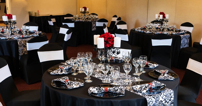 Interior, tables with tableware and glasses ready for guests