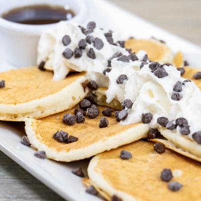 Pancakes with cream and chocolate chips.