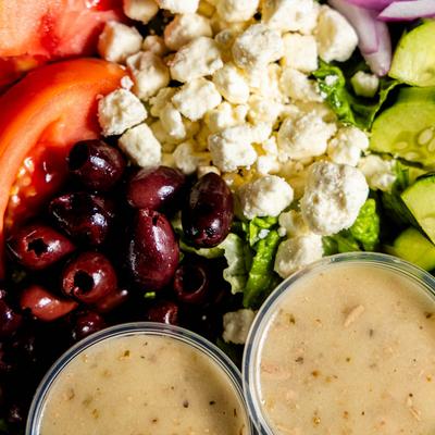 Garden Salad, with greens, tomatoes, peppers, olives, cucumber, cheddar, and croutons.