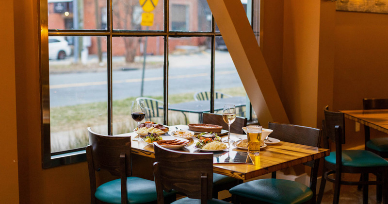 Interior, a guest table with served food and drinks