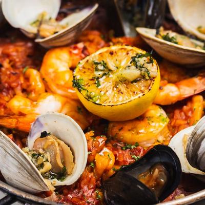 A close up of seafood paella dish.