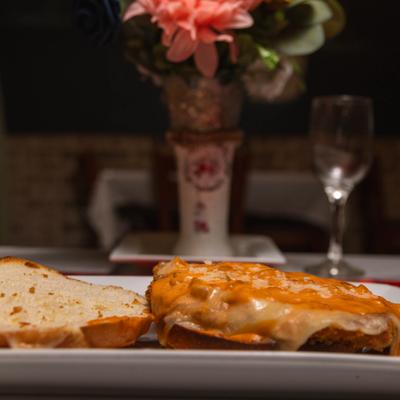 Open-faced chicken Parmesan sandwich.