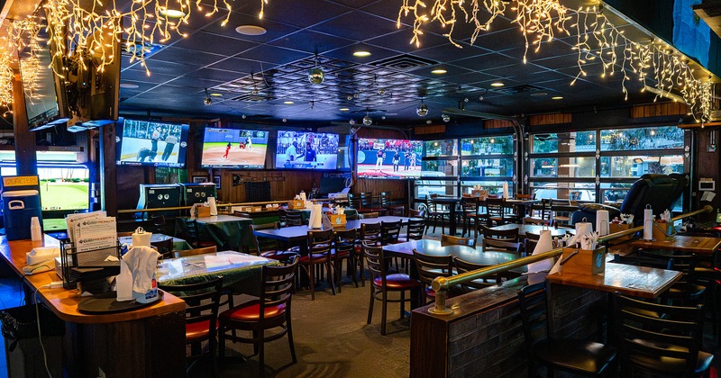 Irish sports pub interior space, seating area, TV sets on the wall