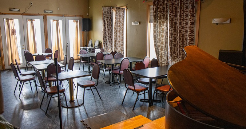 Interior, seating area, a stage with a piano