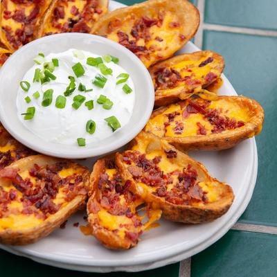 Small sandwiches, white dip in the middle.