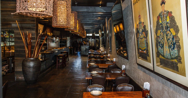 Interior, tables and chairs all lined up with bar on the left side