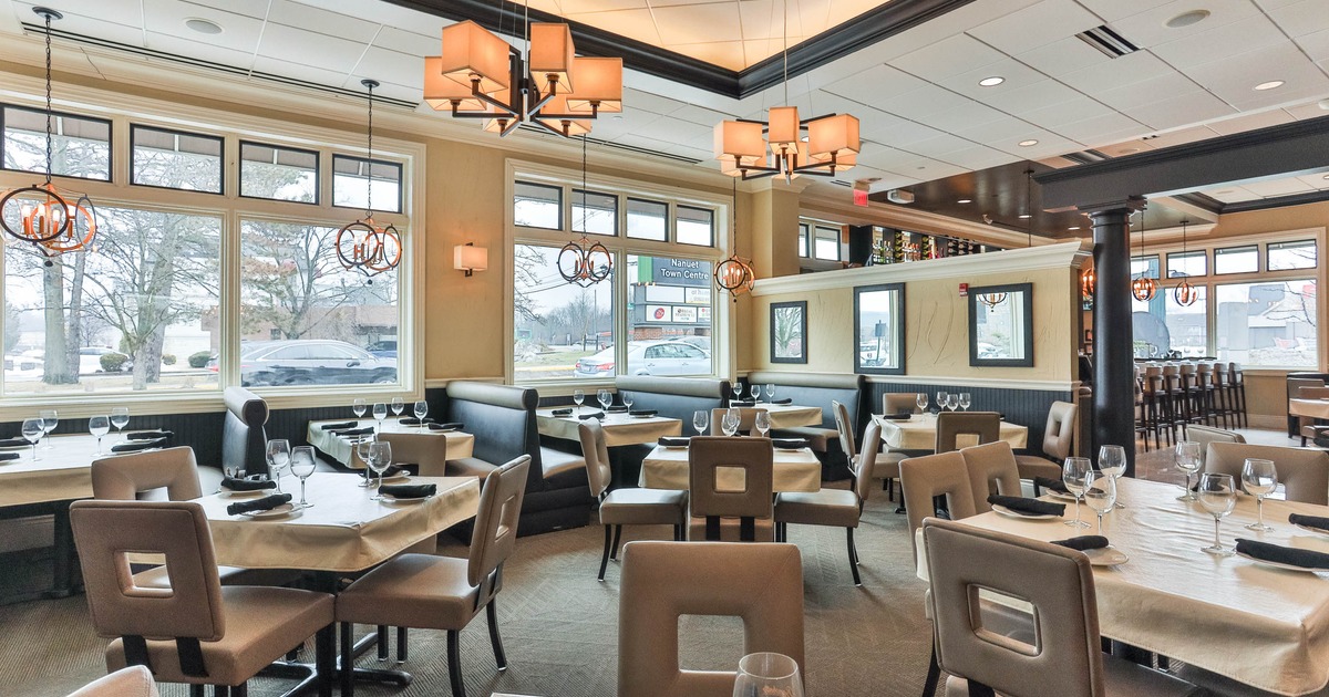 Interior, dining area with tables set for guests