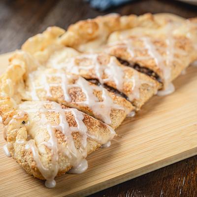 Stuffed cinnamon roll, served.