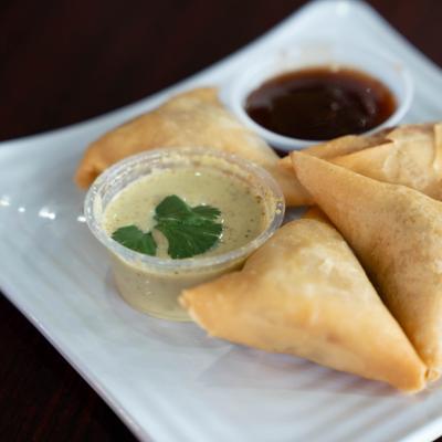 Samosas and dipping sauces.