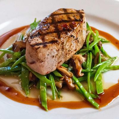 Ahi tuna filet served with house teriyaki, snow peas and shiitake mushrooms