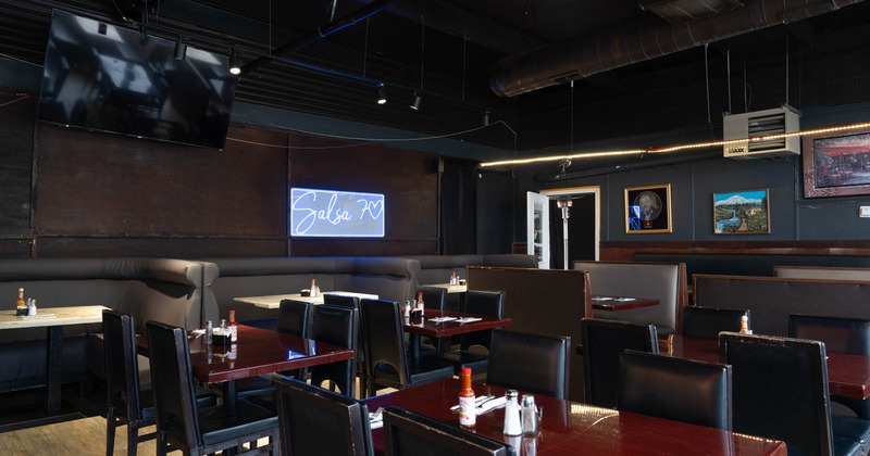 Interior, tables and chairs with restaurant booths in dining area