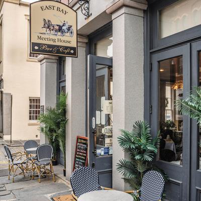 Exterior, front entrance and seating area.