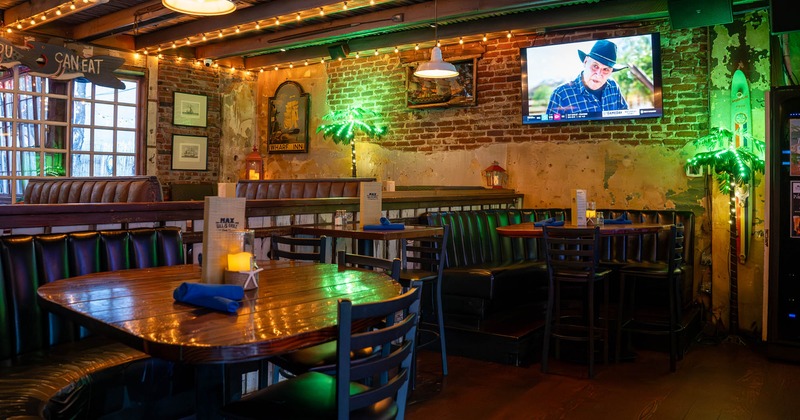 Interior, dining area, regular and cornered seating booths with tables, padded in leather