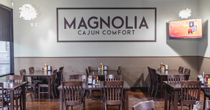 Interior, dining area and restaurant's logo on the wall