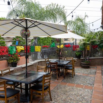 Outdoor tables with parasols.