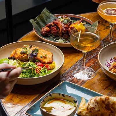 Multiple dishes and drinks.