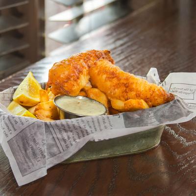 Fish and chips, with lemon and tartar sauce.