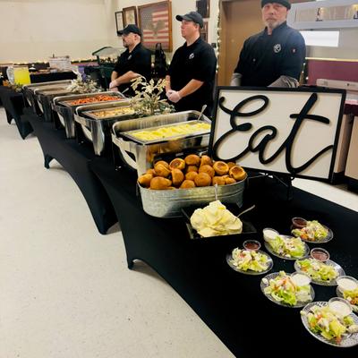 Open table food and the staff standing at attention.