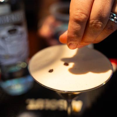 Espresso Martini garnished with coffee beans.