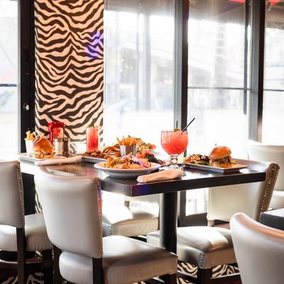 A full table, chairs, windows.