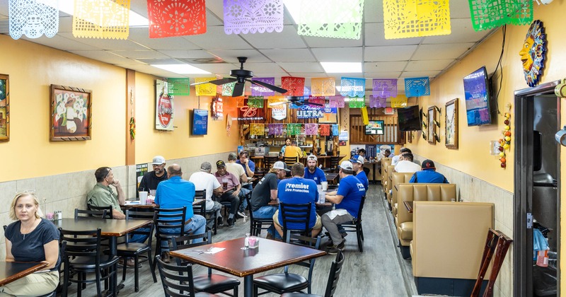 Interior, tables and chairs, guests sitting and chatting