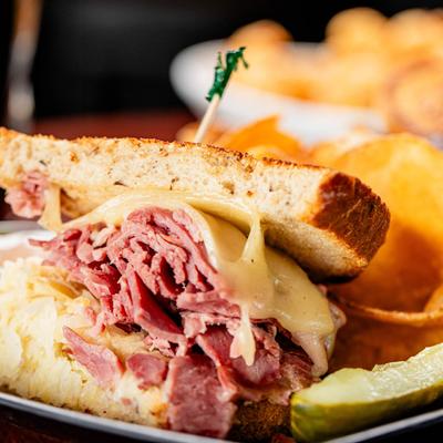 Corned beef Reuben sandwich on grilled rye bread.