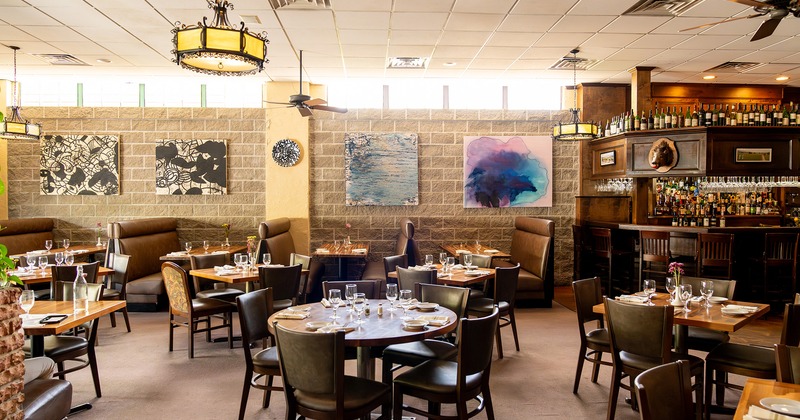 Nicely done interior dining area with set tables ready for guests