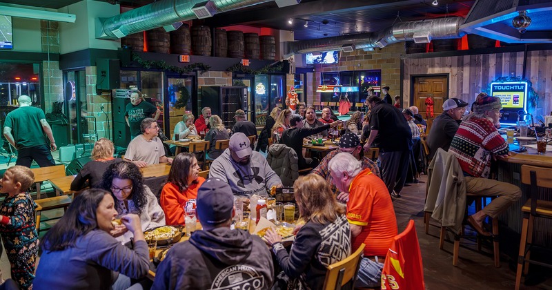 Interior, seating area, guests chatting and enjoying their food and drinks