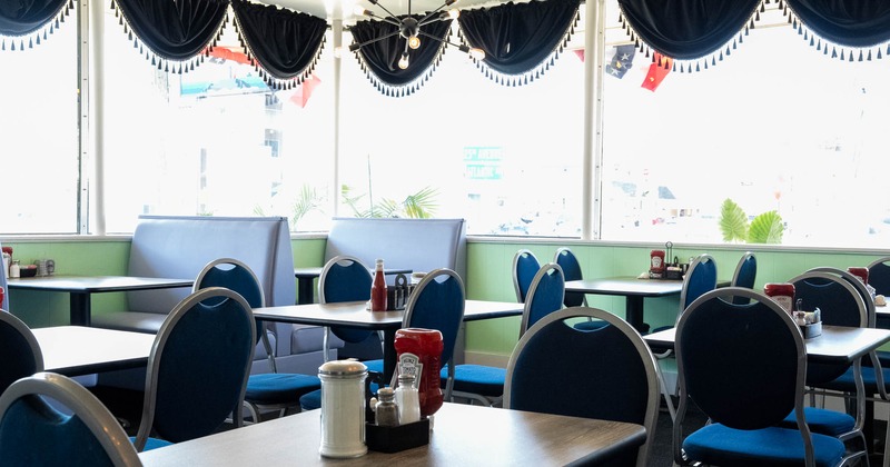 Interior, tables and chairs in dining area