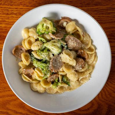 Orecchiette pasta with spicy Italian sausage, broccolini, garlic, and white wine sauce.