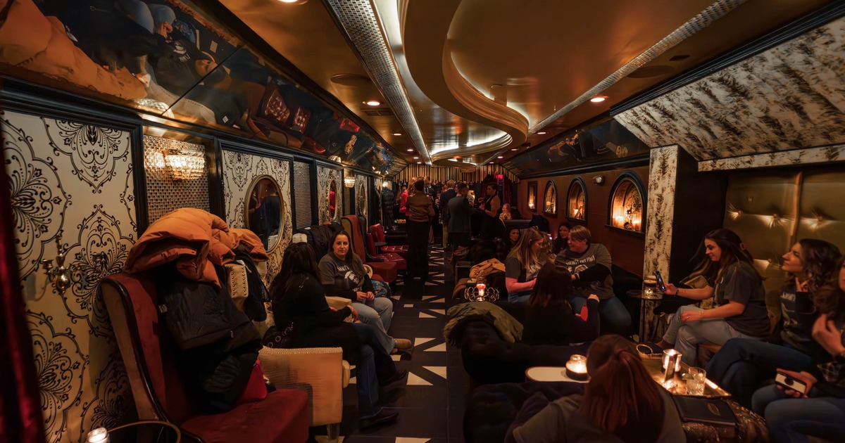 Lounge area, guests sitting in a long and narrow corridor