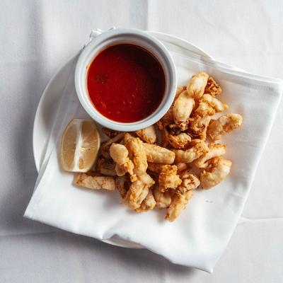 Fried calamari, with cocktail sauce.