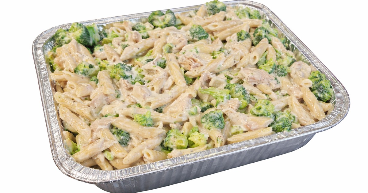 Chicken broccoli alfredo pasta served in a catering tray