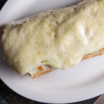 Burrito, topped with melted cheese