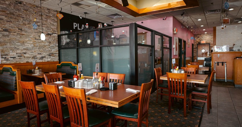 Interior, table set for guests in dining area