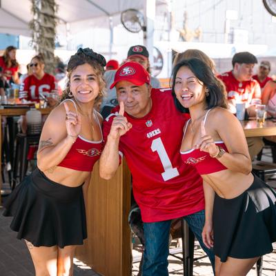 Three persons posing for a photo.