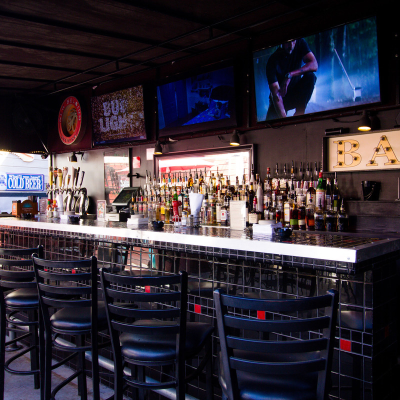 Interior, bar and barstools, big tv screens