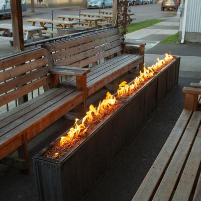 Benches outside on the patio along the firepits.