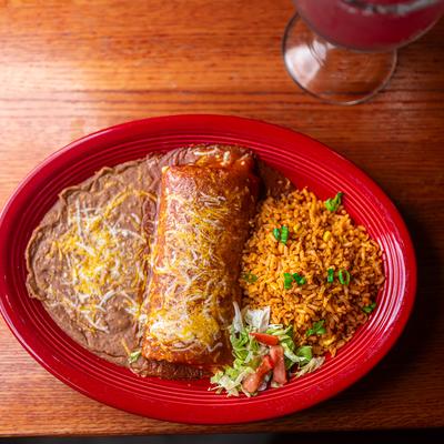 Burrito with enchilada sauce, rice and beans.