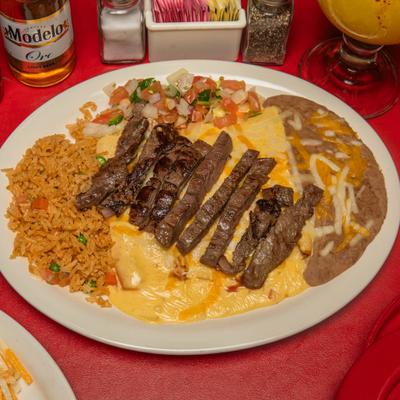 Cheese enchiladas topped with sliced carne asada steak, alongside rice, refried beans, and pico.