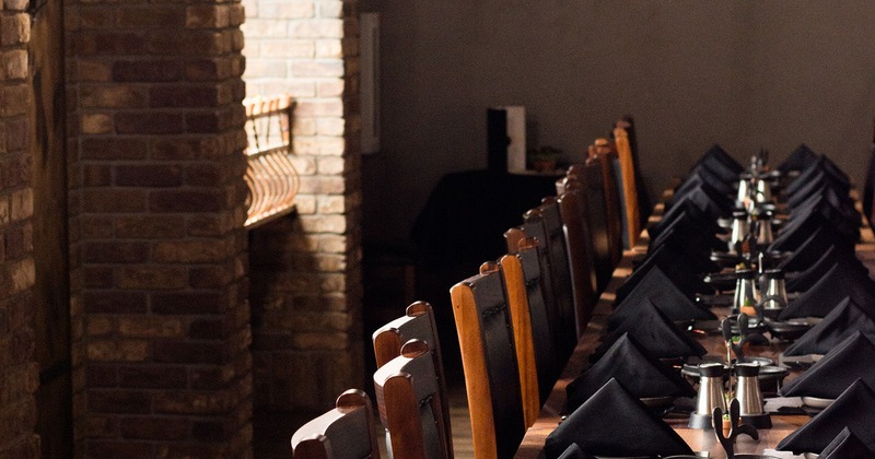 Private room, a long dining table set for a large group