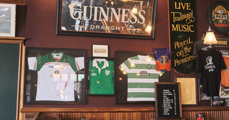 Interior, framed soccer jerseys on a wall