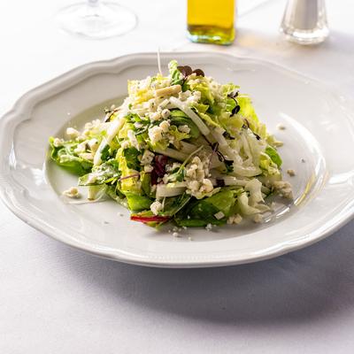 Mixed green salad, with pears and Vidalia onion.