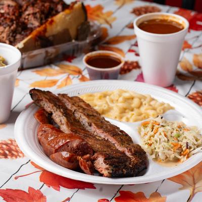 Brisket and links, served with mac and cheese and coleslaw.