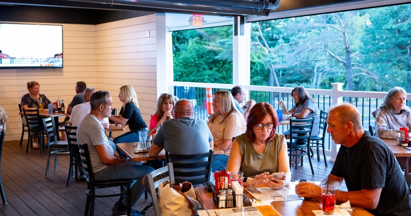 Terrace, tables and chairs, people dining