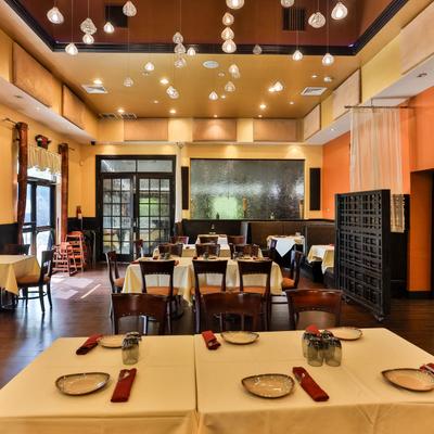Indoor dining area with set tables.