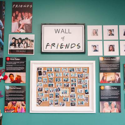 Friends TV show memorabilia on a wall.