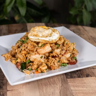 Cajun fried rice with shrimp and sausage, topped with fried egg.