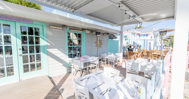 Outdoor seating area, tables ready for guests