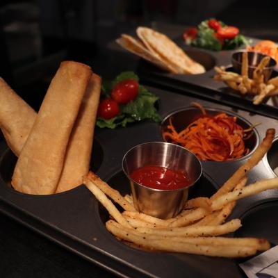 Taquitos served with fries, fresh vegetables and salsa.